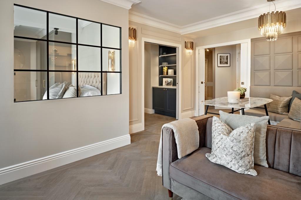 Herringbone oak flooring and Crittall-style internal screen