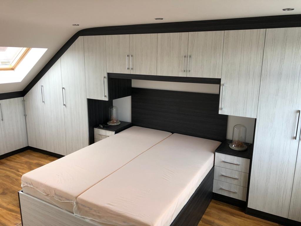 Dormer loft conversion bedroom with wall-to-wall fitted wardrobes