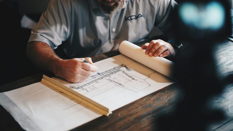 Architect marking up garage conversion drawings for Building Regulations approval