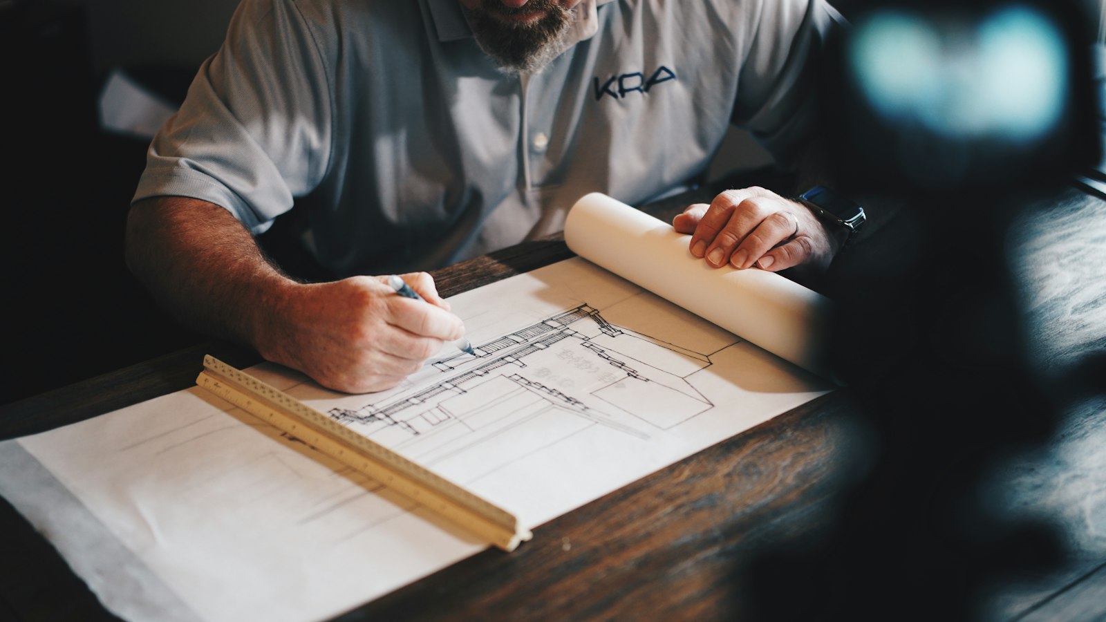 Architect marking up garage conversion drawings for Building Regulations approval