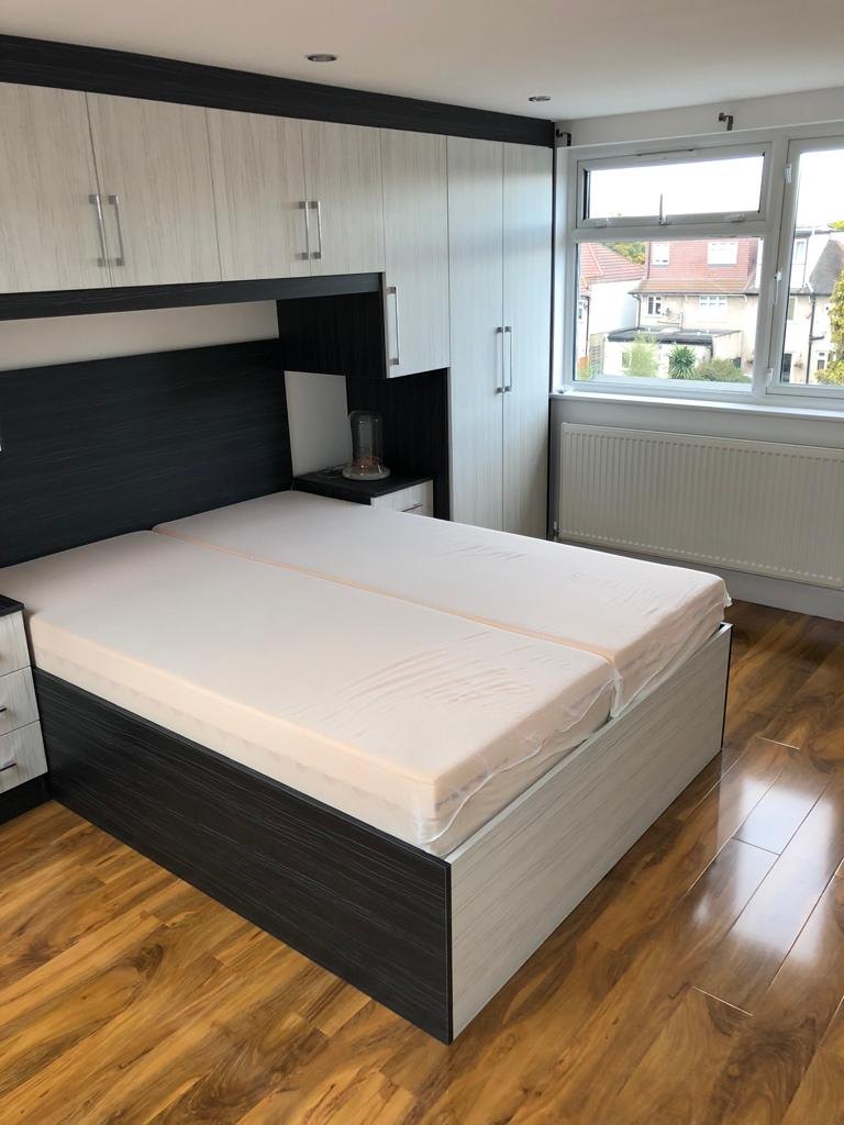 Loft conversion bedroom with fitted wardrobes and oak flooring – GSM Builders Ltd, Bexleyheath